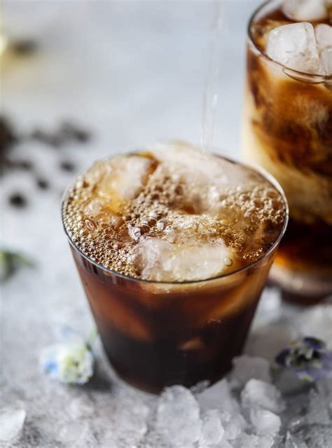 Coffee soda - Simple syrup can be easily made by combining equal parts of sugar and water and heating it up so that it dissolves. To make 1 oz of simple syrup, combine ¾ of an ounce of water and ¾ of an ounce of sugar and dissolve. To make the magic happen, mix your cold brew concentrate and simple syrup first, add soda water to taste, then top with ice ...